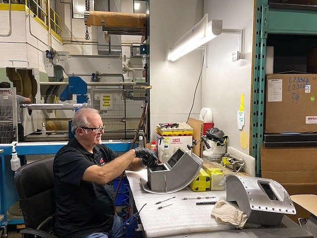 LHM Technologies employee working on the factory floor