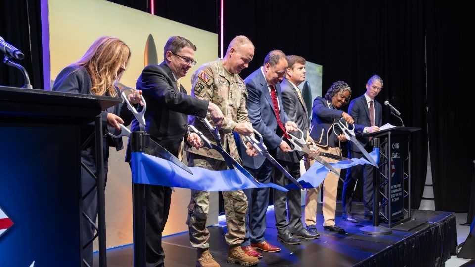 Lockheed Martin leaders cut the ribbon during the grand opening of Missile Assembly Building 5 (MAB-5) in Courtland, Alabama.